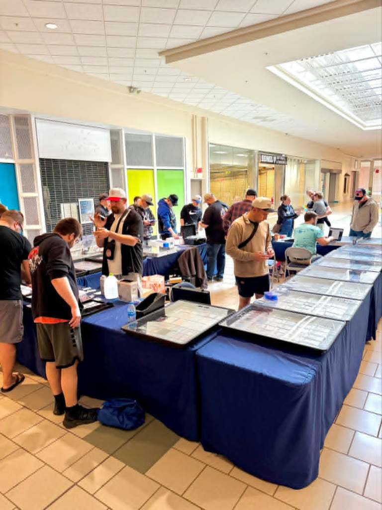 Browsing collectibles at a mall card show
